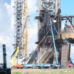 2nd launch tower stacking completed at Starbase (left), SpaceX prepares the Mechazilla Chopsticks to catch the Flight 5 Super Heavy rocket booster (right).