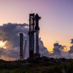 Fully integrated Flight 5 Starship mounted on the orbital launch mount (OLM) at the SpaceX Starbase launch site in Boca Chica, Texas.