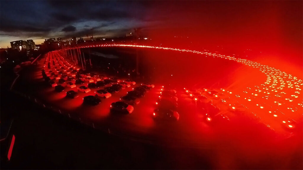 902 Teslas gather at a race circuit in Espoo, Finland for a mega light show.