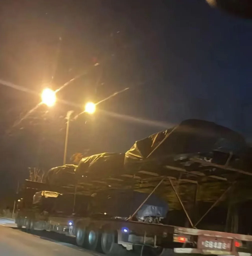 A car carrier trailer transporting freshly-produced Tesla Model  Y Juniper electric SUVs from Giga Shanghai.