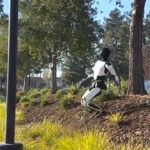 Tesla's humanoid robot Optimus almost took a tumble during an autonomous walk test on a steep slope.